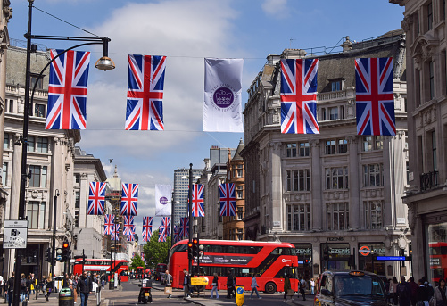 London, UK. 10th May 2022. Union Jack flags on Oxford Street for the Queen's Platinum Jubilee, marking the 70th anniversary of the Queen's accession to the throne.