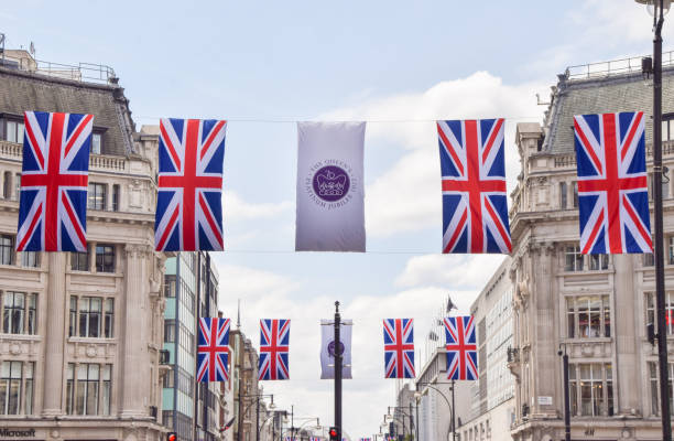 Union Jacks on Oxford Street for the Queen's Platinum Jubilee London, UK. 10th May 2022. Union Jack flags on Oxford Street for the Queen's Platinum Jubilee, marking the 70th anniversary of the Queen's accession to the throne. british royalty photos stock pictures, royalty-free photos & images