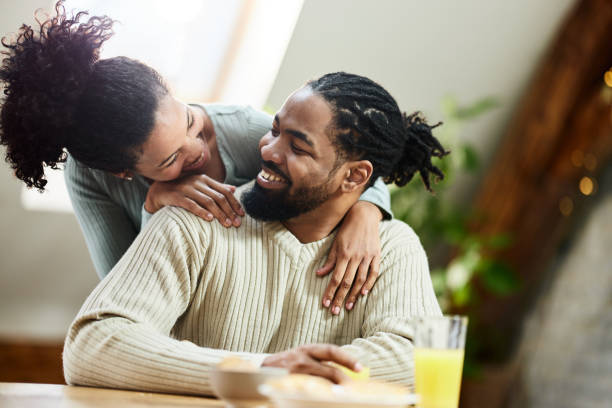 istock Happy black couple talking during morning at home. 1397876210