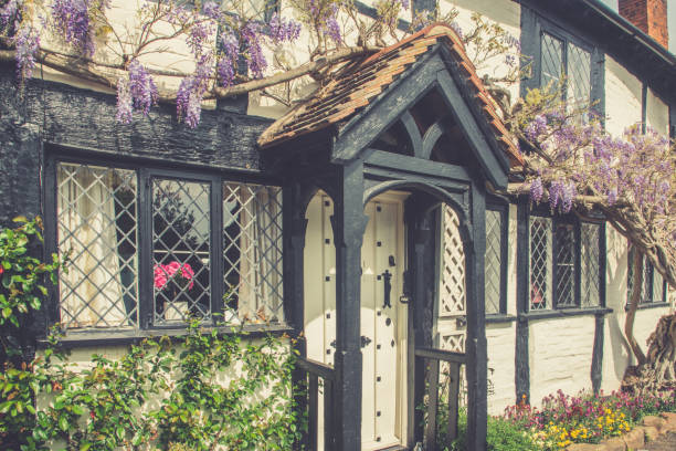 Lovely old timbered house in the heart of England. Picturesque facade with  Lobelia trellis plant.