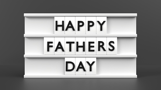 Happy Fathers Day text is displaying on a vintage letter board light box to celebrate Father’s Day against gray background. Easy to crop for all your social media and print sizes.