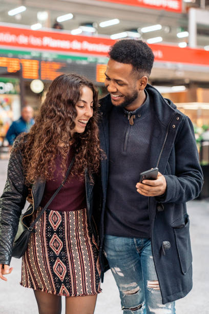 istock Happy Young Couple Using Phone 1397880615