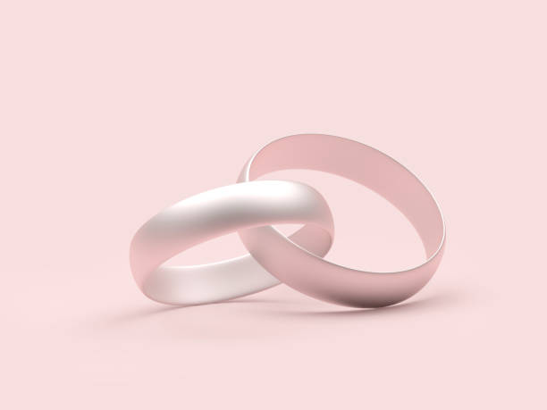 istock Silver connected wedding rings on pink. 1397882050
