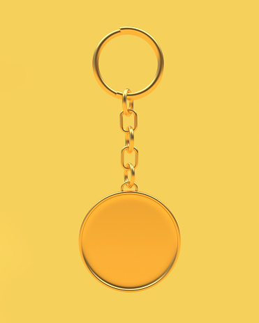 Golden round blank keychain on yellow. 3D illustration