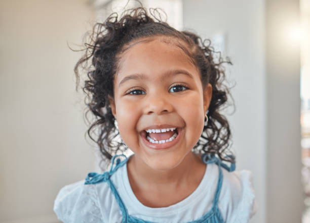 Shot of a happy little girl at home No worries, no cares, just smiles 4 year old girl stock pictures, royalty-free photos & images
