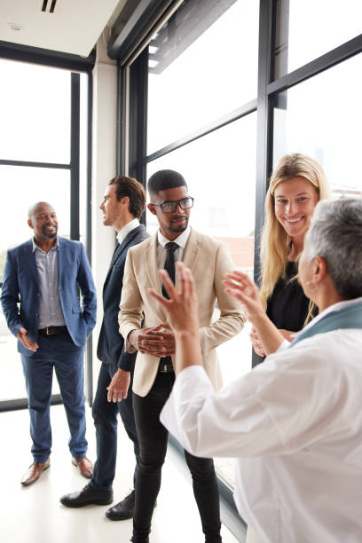 istock Diverse businesspeople talking together in an office boardroom 1397884759