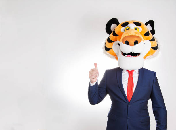 istock Man businessman in tiger mask on white background and showing class gesture. Copy space for text 1397884838