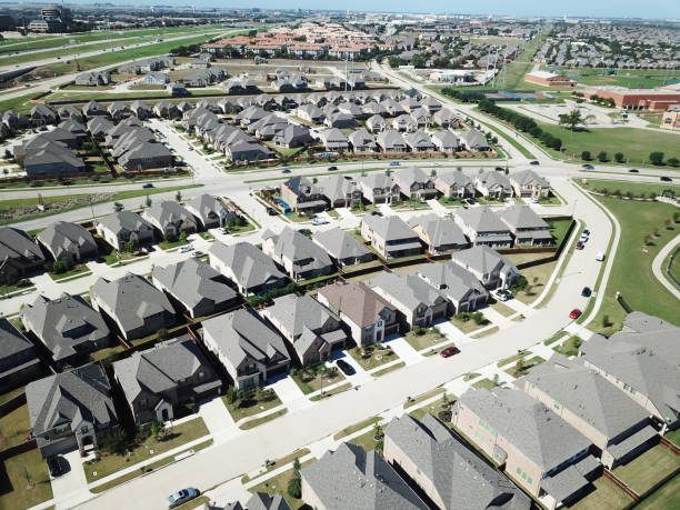 istock New development upscale two story houses with apartment complex in background in North Texas, America 1397886746