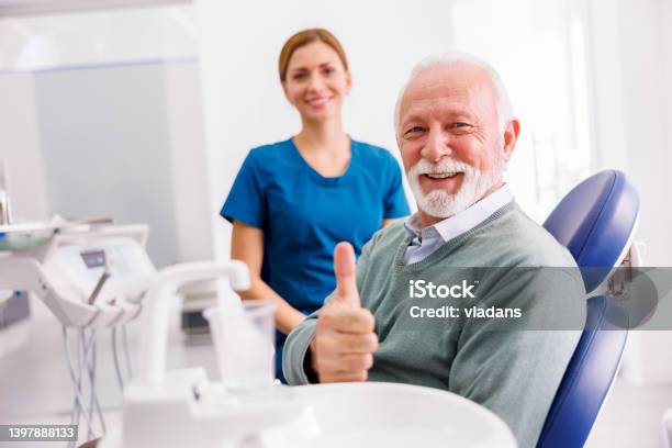 Senior Man At Dentist Office Showing Thumbs Up Stock Photo - Download Image Now - Dentist, Patient, Senior Adult