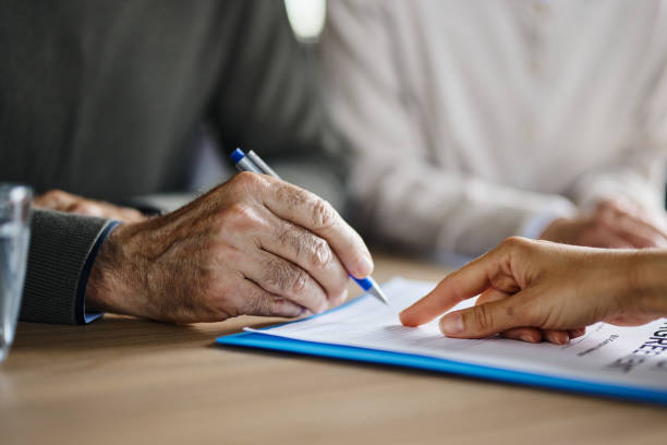 istock Close up of unrecognizable person signing a contract. 1397888766