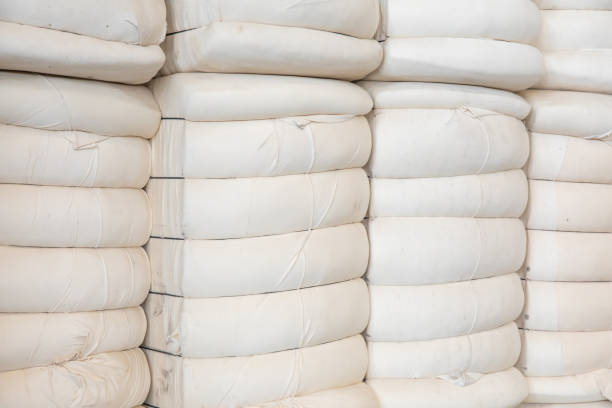 istock Pile or stack of cotton bales at textile factory or industry 1397888918