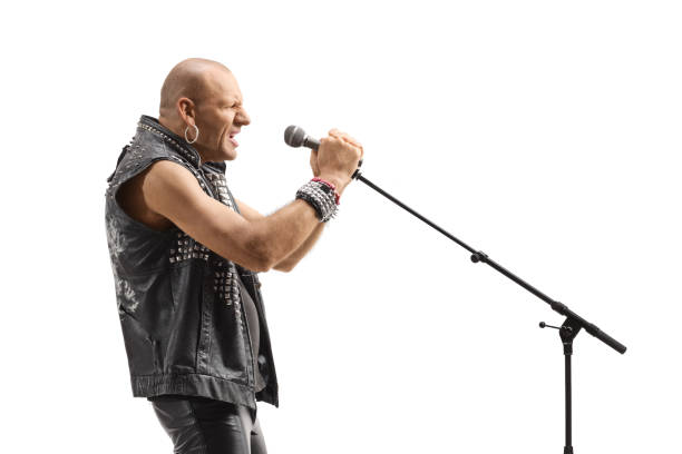 istock Male singer signing rock on a microphone 1397890205