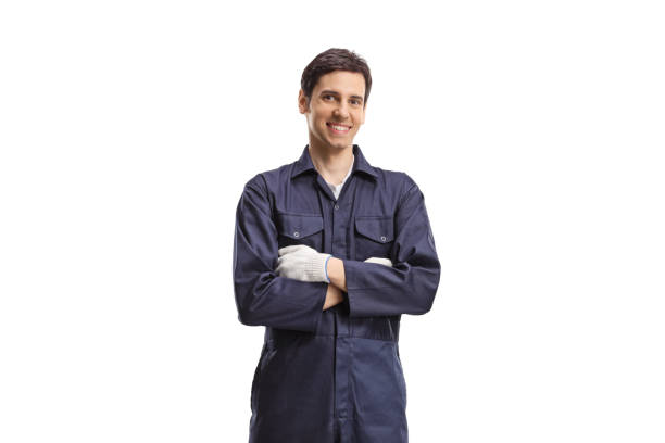 istock Smiling male worker in a uniform posing with crossed arms 1397890512