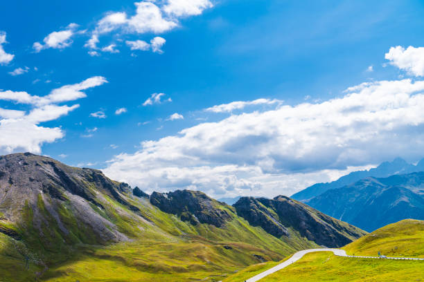 Austrian alps in early autumn - mountain range in clouds. Mountains landscape.