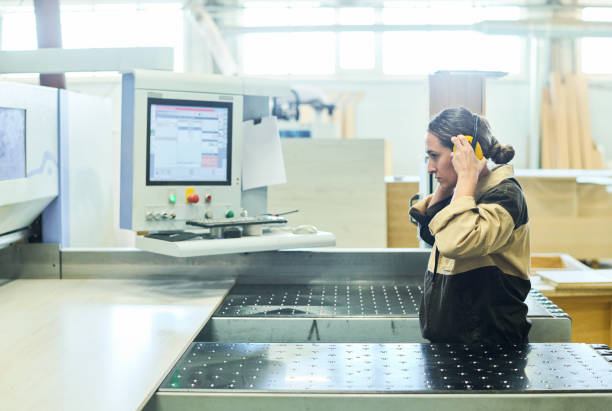 istock Woman working at manufacturing equipment 1397893326