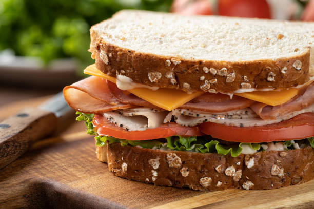 istock Turkey and ham sandwich on whole grain bread 1397894600