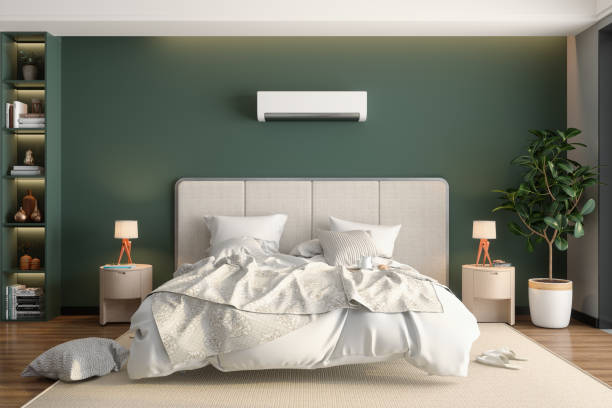 Modern Bedroom Interior With Front View Of Messy Double Bed, Air Conditioner, Night Tables And Potted Plant Modern Bedroom Interior With Front View Of Messy Double Bed, Air Conditioner, Night Tables And Potted Plant owners bedroom photos stock pictures, royalty-free photos & images