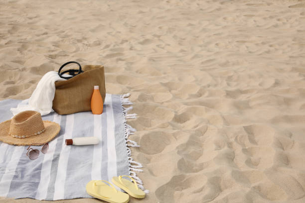 istock Bag and other beach items on sand, space for text 1397902195