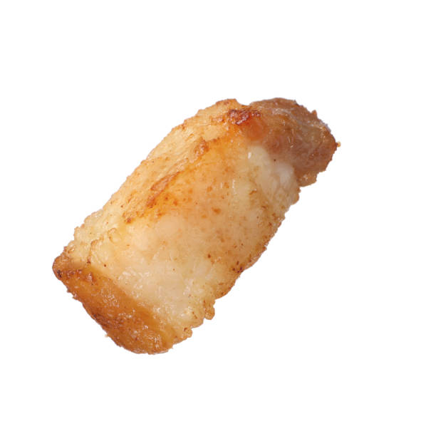 istock Tasty fried crackling isolated on white. Cooked pork lard 1397906218
