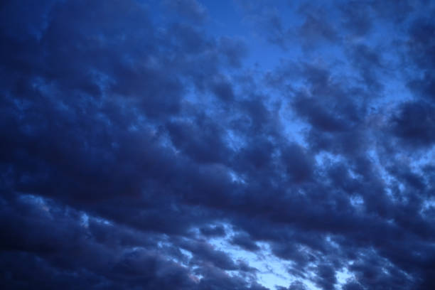 istock Nature dark blue sky background with clouds 1397908126