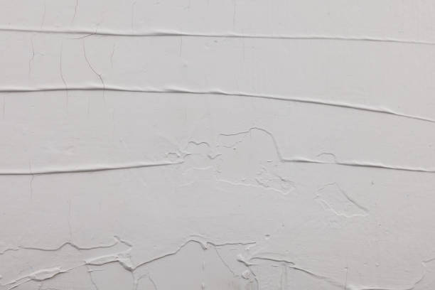 istock unevenly applied white putty with cracks and spatula marks 1397908275