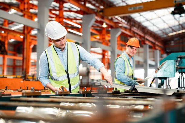 istock The Maintenance looking of working at industrial machinery and check security system in factory. 1397909735
