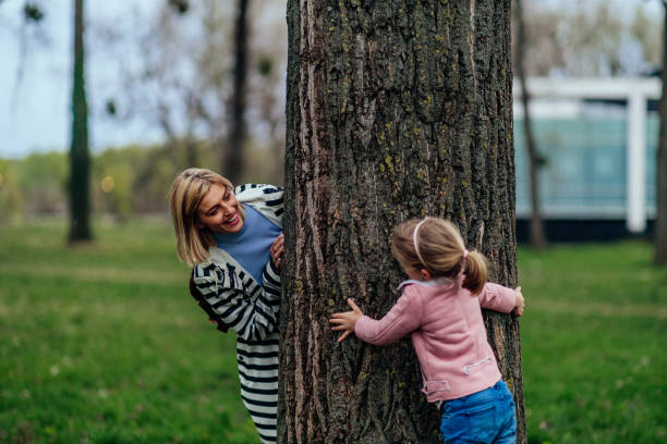 istock mom and daughter play in park 1397910286
