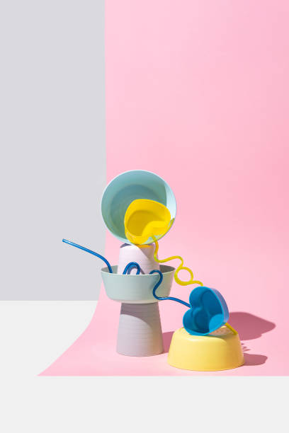 istock Equilibrium installation with pastel colored plastic bowls on a pink background 1397912506
