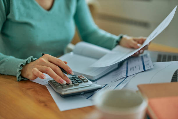 istock Woman planning her financial budget at home 1397912607
