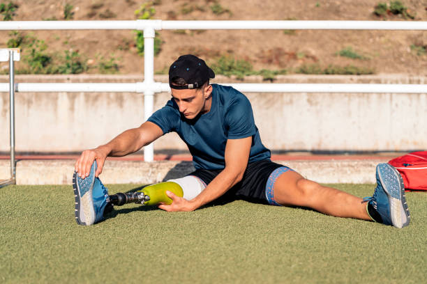 istock Disabled man athlete stretching with leg prosthesis. 1397912844