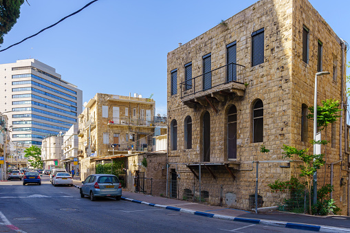 Haifa, Israel - May 12, 2022: View of a street with old buildings, in Hadar HaCarmel Neighborhood, Haifa, Israel