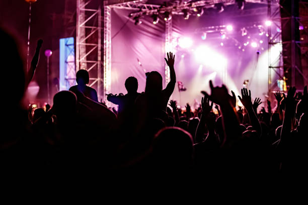 istock Happy crowd at a music festival. 1397914929