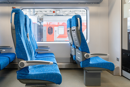 Inside of a empty commuters train with space for bikes. As bikes grow more and more popular as a tool for transportation, it has been possible to take the bikes into town with the local train system