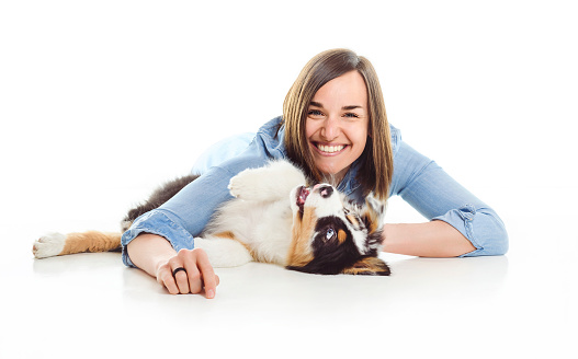A Handsome female with her Australian Berger puppy on studio