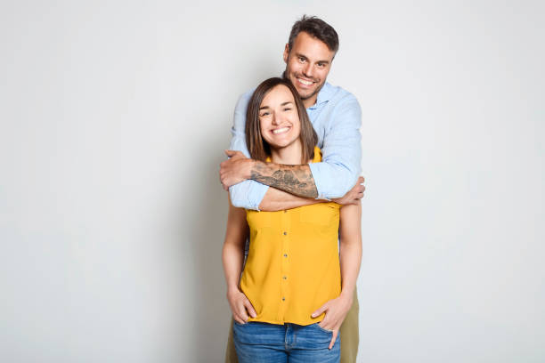 istock Attractive couple in studio white background having fun 1397916303