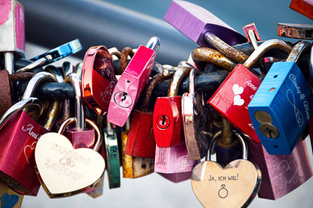istock Closed padlocks hang on a pole as a love oath. 1397917768