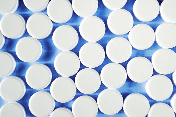 Round white small pills. stock photo