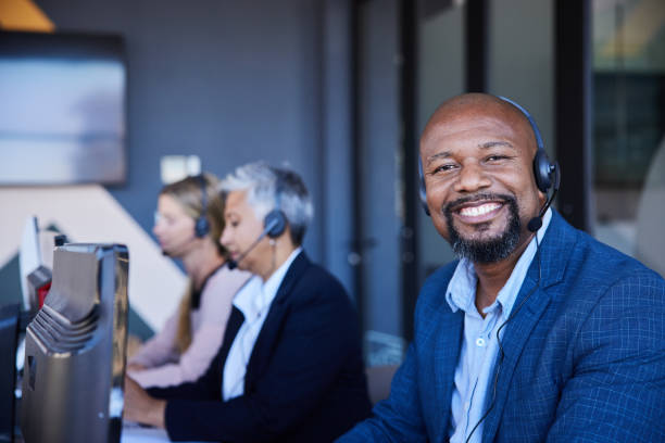 istock Mature male customer service representative smiling in an office 1397921980