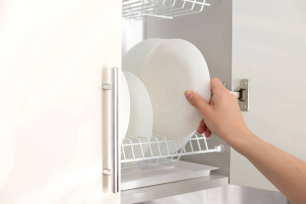 istock Take a clean white plate on the kitchen shelf. close-up 1397922371