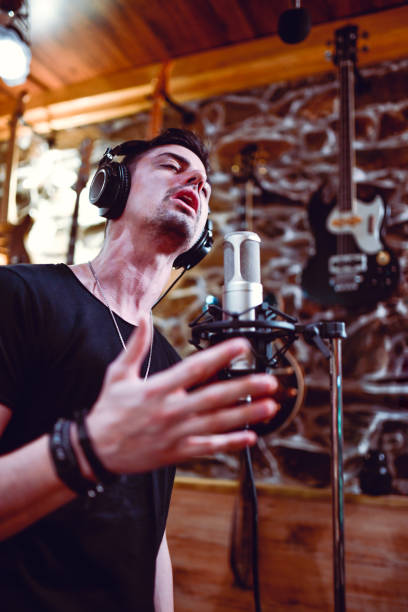 istock Male Singer Giving His Best Performance In Studio 1397923312