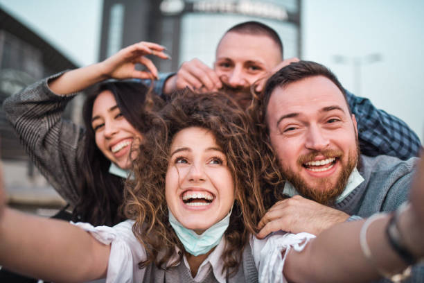 istock Happy Smiling Friends Having Fun While Taking Selfie Outside 1397924042