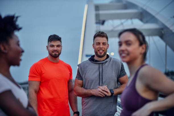 istock Group of people resting after running 1397924379