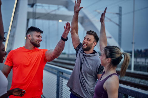 istock Happy sporty people celebrating after training 1397924534