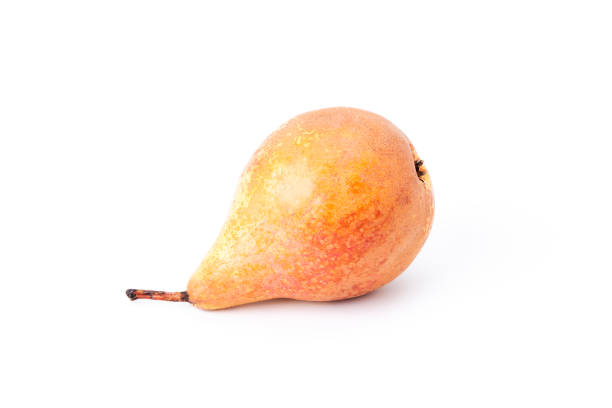 Ripe reddish colored pear on a white background. Vegan and vegetarian food. Ripe and healthy fruit