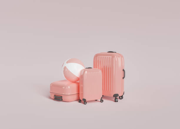 istock Pink suitcases and beach ball 1397925536