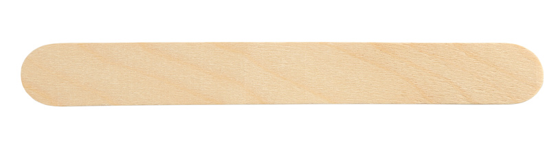 Disposable wooden spatula for depilatory wax isolated on white