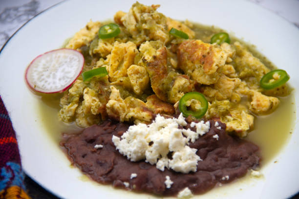 istock Egg with green sauce and refried beans. Mexican food 1397926323
