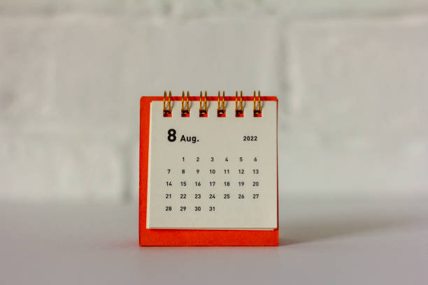 istock Desktop mini calendar for August 2022 on the table. 1397926436