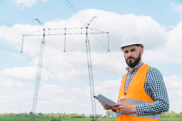 istock Engineer working near transmission lines. Electricity pylons 1397927403