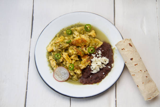 istock Egg with green sauce and refried beans. Mexican food 1397927536